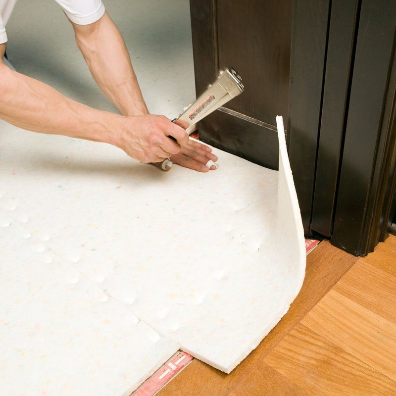 Person installing flooring underlayment from 180 Degree Floors in the Nashville, TN area