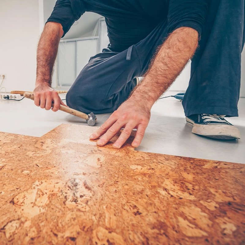 Person installing cork flooring from 180 Degree Floors in the Nashville, TN area